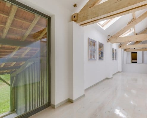 Upstairs gite hallway with exposed beams