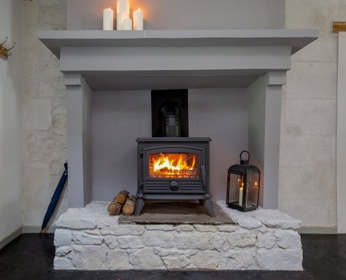 Beautiful gite fireplace with woodburning stove