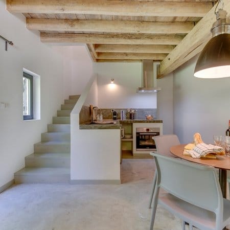 Casual Gite dining area with stairs to upper floors