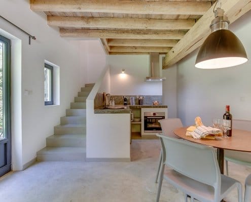 Casual Gite dining area with stairs to upper floors