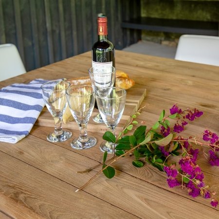 Flowers, glasses and French wine on a table