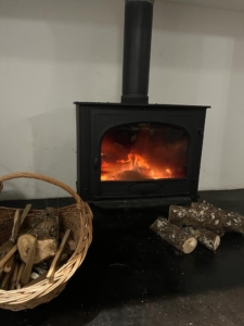 Wood-burning fireplace in Gite