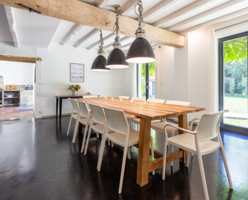 Beautiful gite dining table with kitchen entrance
