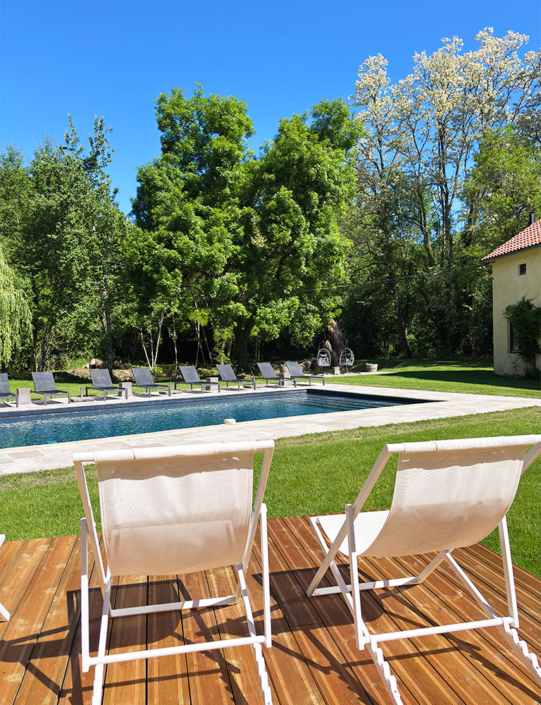 Deck chairs and sun loungers by the pool