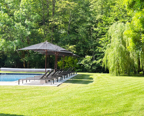 Gite swimming pool and lush green lawn