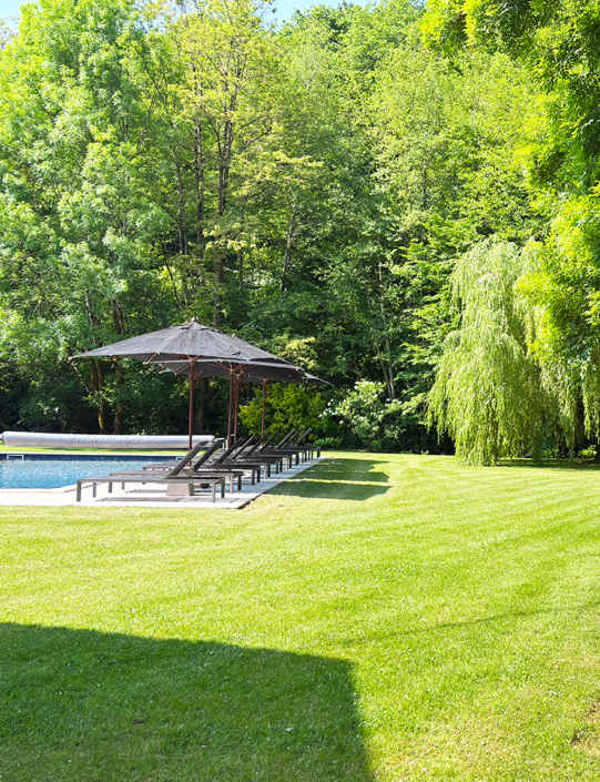 Gite swimming pool and lush green lawn