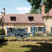 Restored hay wagon outside Dordogne gite