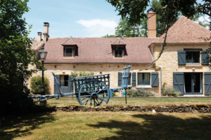 Restored hay wagon outside Dordogne gite
