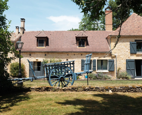Restored hay wagon outside Dordogne gite
