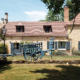Restored hay wagon outside Dordogne gite