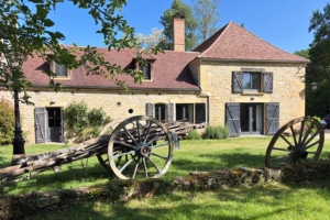 Restored hay wagon outside Dordogne gite