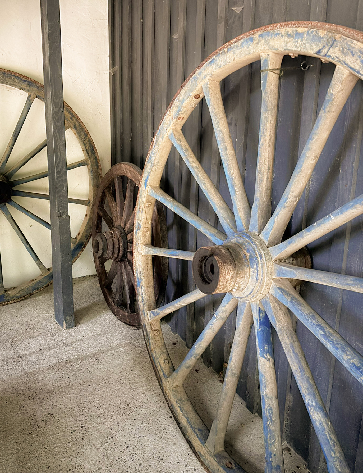 Rustic wagon wheels in barn Antique waggon wheels in French barn